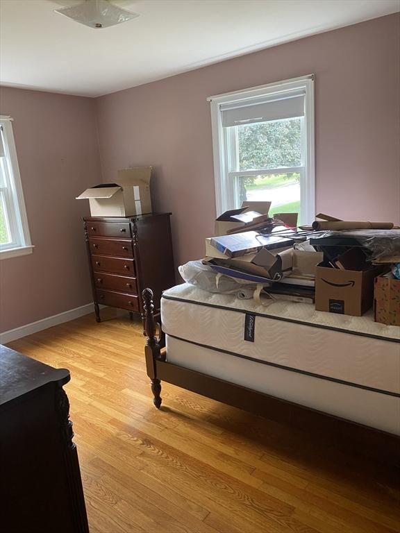 bedroom with light wood finished floors