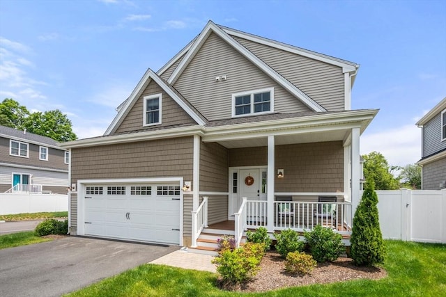 34 Sumner St Unit 34, Norfolk, MA 02056 - view of front facade with a porch, asphalt driveway, and an attached garage