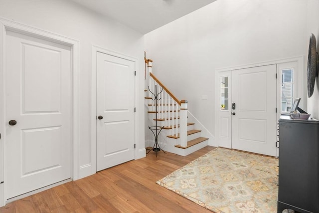 34 Sumner St Unit 34, Norfolk, MA 02056 - entrance foyer featuring light wood-style flooring and stairway