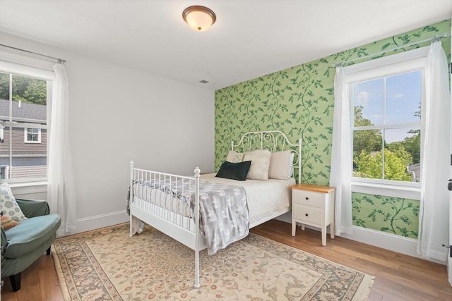 34 Sumner St Unit 34, Norfolk, MA 02056 - bedroom with wallpapered walls and wood finished floors