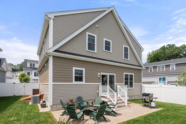 34 Sumner St Unit 34, Norfolk, MA 02056 - back of property with a patio, a gate, and a fenced backyard