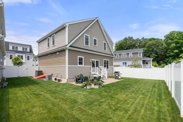 34 Sumner St Unit 34, Norfolk, MA 02056 - back of house featuring a patio area, a fenced backyard, and a gate