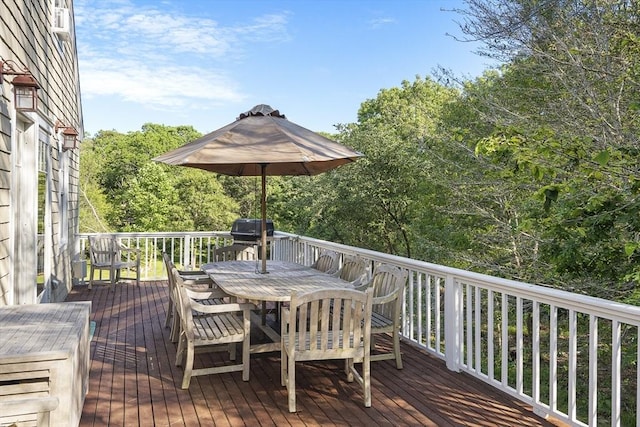 wooden terrace featuring a grill