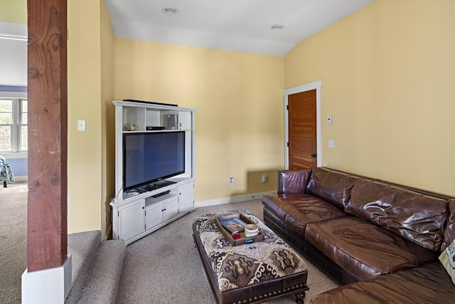 living room with vaulted ceiling and carpet