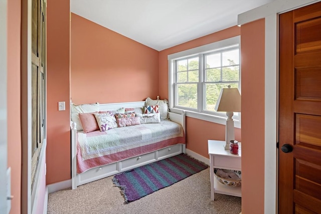 carpeted bedroom with vaulted ceiling