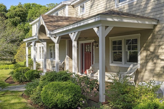 view of exterior entry with covered porch