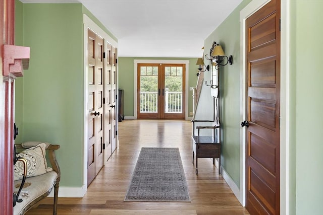 doorway featuring french doors and light hardwood / wood-style floors