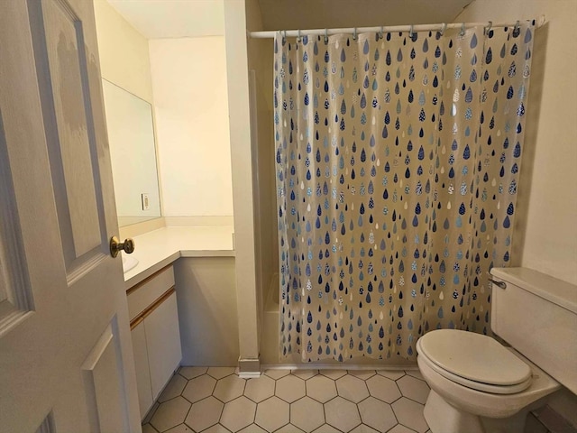 full bathroom with vanity, toilet, and shower / tub combo