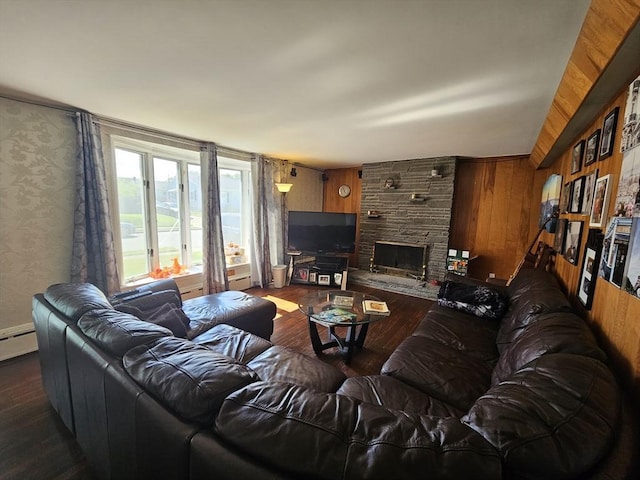344 Frieda St, New Bedford, MA 02744 - living room featuring dark wood-style flooring, wooden walls, and a stone fireplace