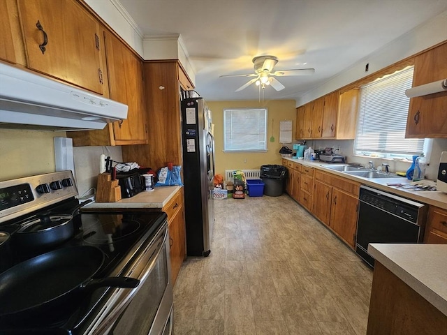 344 Frieda St, New Bedford, MA 02744 - kitchen with appliances with stainless steel finishes, a sink, under cabinet range hood, brown cabinetry, and light countertops