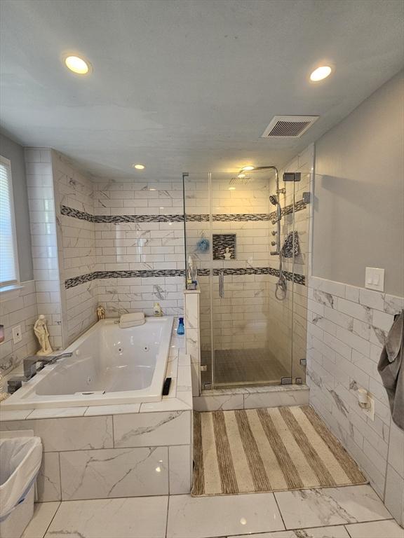 344 Frieda St, New Bedford, MA 02744 - bathroom with a shower stall, a jetted tub, tile walls, recessed lighting, and marble finish flooring