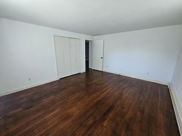 344 Frieda St, New Bedford, MA 02744 - unfurnished bedroom featuring dark wood-style floors, baseboards, and a closet