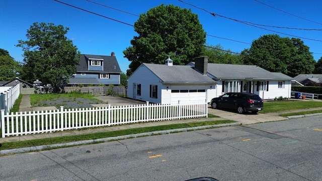 344 Frieda St, New Bedford, MA 02744 - view of front of home featuring a fenced front yard and a garage
