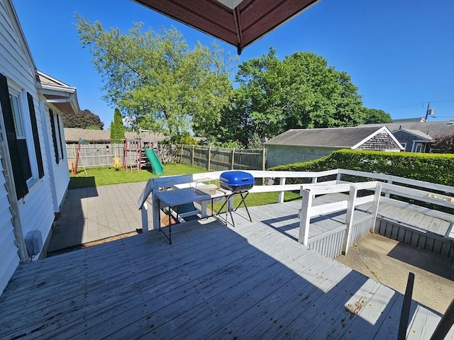 344 Frieda St, New Bedford, MA 02744 - wooden terrace with a playground and a fenced backyard