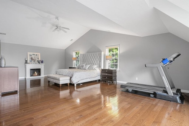 6 Paddock Dr, Lincoln, RI 02865 - bedroom with lofted ceiling, light wood-type flooring, ceiling fan, baseboards, and a glass covered fireplace