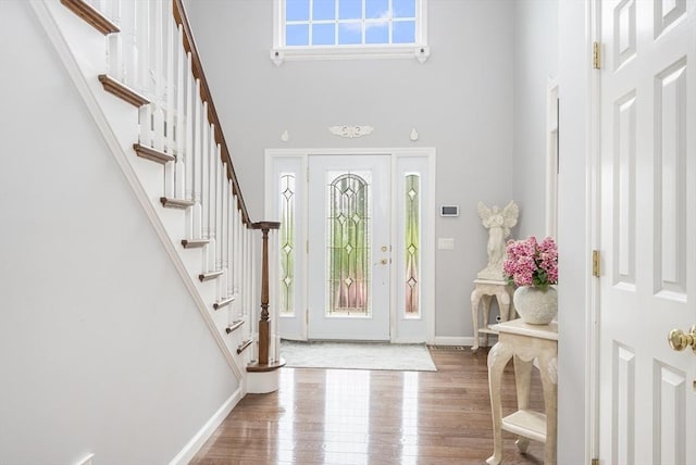 6 Paddock Dr, Lincoln, RI 02865 - entrance foyer with a high ceiling, wood finished floors, stairs, and baseboards