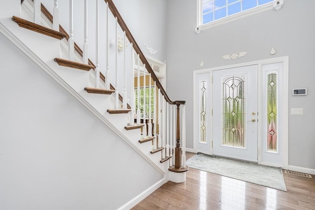 6 Paddock Dr, Lincoln, RI 02865 - foyer with wood finished floors, stairway, a towering ceiling, and baseboards