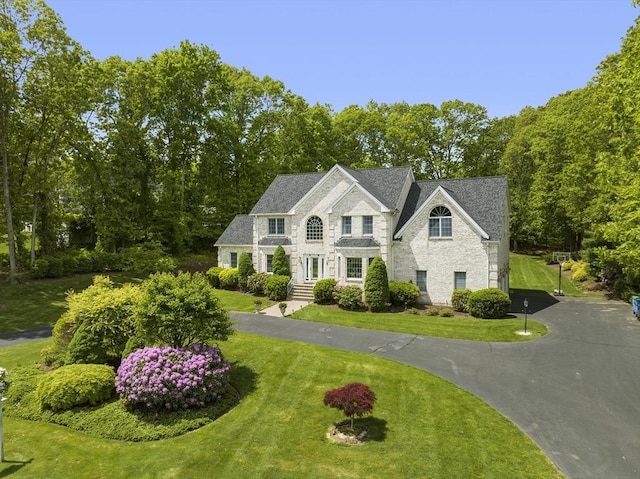 6 Paddock Dr, Lincoln, RI 02865 - view of front of house with a front yard and stone siding