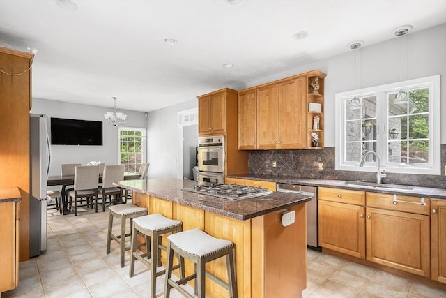 6 Paddock Dr, Lincoln, RI 02865 - kitchen with appliances with stainless steel finishes, a sink, a chandelier, backsplash, and a breakfast bar