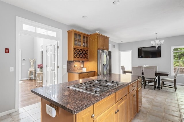 6 Paddock Dr, Lincoln, RI 02865 - kitchen with stainless steel appliances, light tile patterned flooring, baseboards, a chandelier, and glass insert cabinets