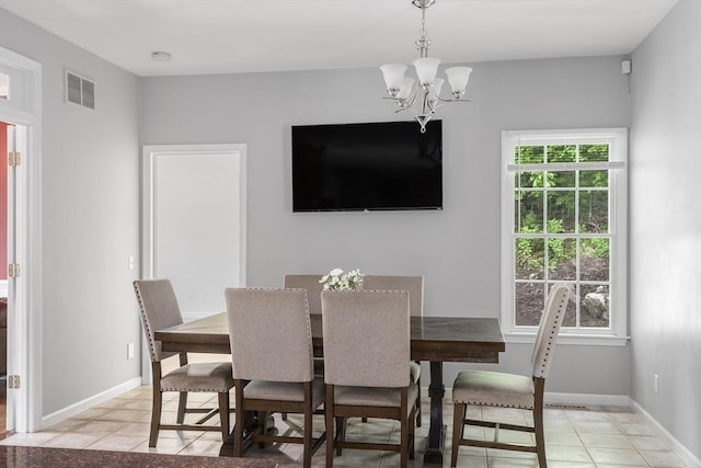 6 Paddock Dr, Lincoln, RI 02865 - dining space featuring a chandelier, light tile patterned flooring, and baseboards