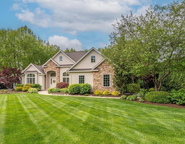 7 Brimfield Way, Westfield, MA 01085 - view of front facade featuring stone siding and a front yard