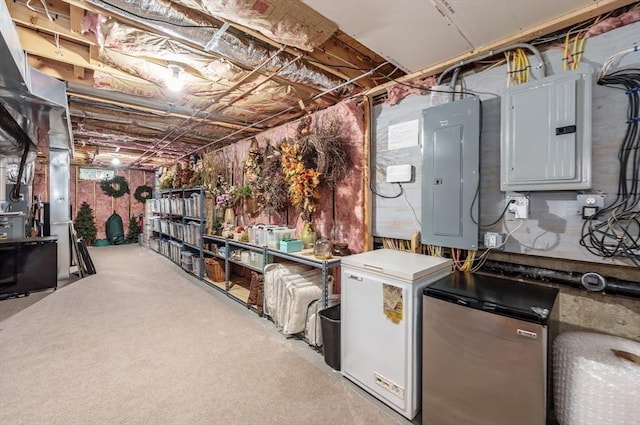 7 Brimfield Way, Westfield, MA 01085 - unfinished below grade area with electric panel, stainless steel fridge, refrigerator, and carpet flooring