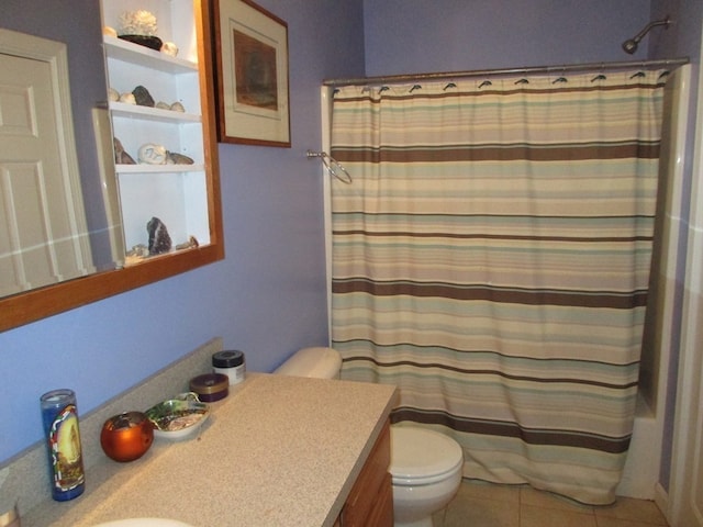 bathroom featuring vanity, toilet, and tile patterned flooring