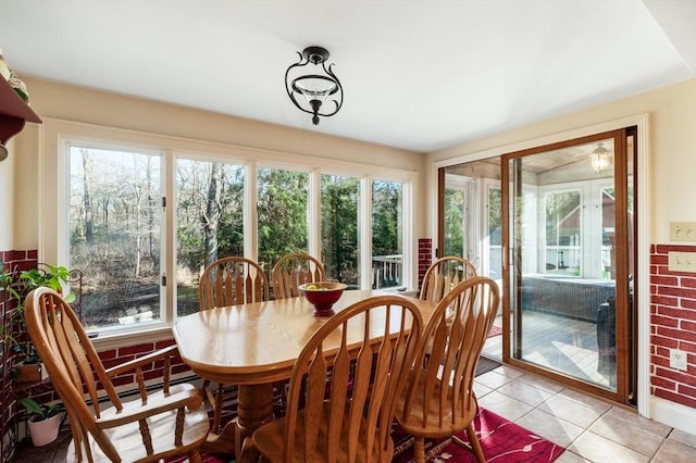 sunroom / solarium featuring a healthy amount of sunlight