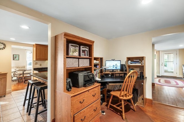 office area with light hardwood / wood-style floors