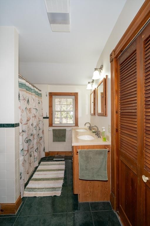 bathroom with tile patterned flooring, vanity, and a shower with shower curtain