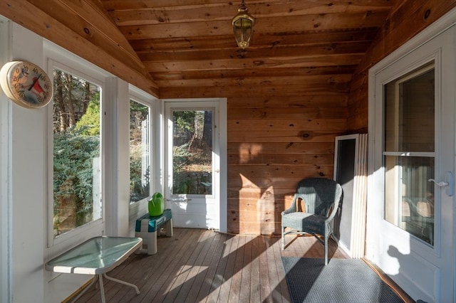 unfurnished sunroom featuring plenty of natural light, wooden ceiling, and vaulted ceiling