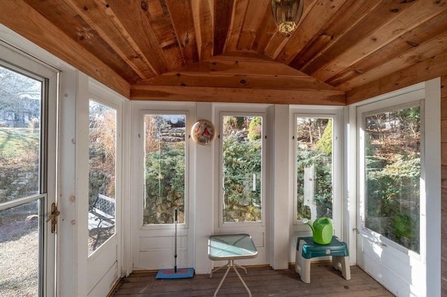 unfurnished sunroom featuring wooden ceiling and vaulted ceiling