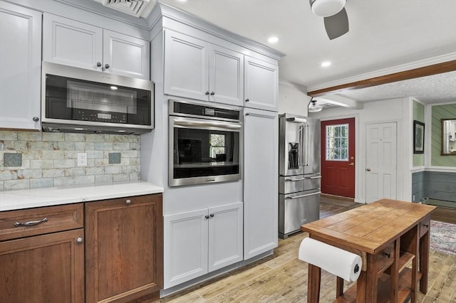29 Shady Ave, Westminster, MA 01473 - kitchen with stainless steel appliances, light countertops, a ceiling fan, and light wood-style floors