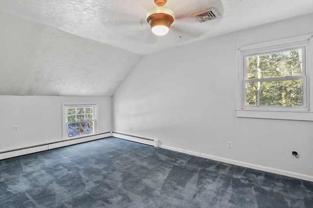 29 Shady Ave, Westminster, MA 01473 - additional living space with lofted ceiling, visible vents, dark carpet, and a textured ceiling