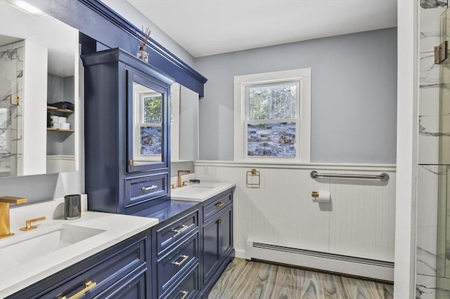 29 Shady Ave, Westminster, MA 01473 - full bathroom featuring wainscoting, double vanity, a baseboard radiator, and a sink