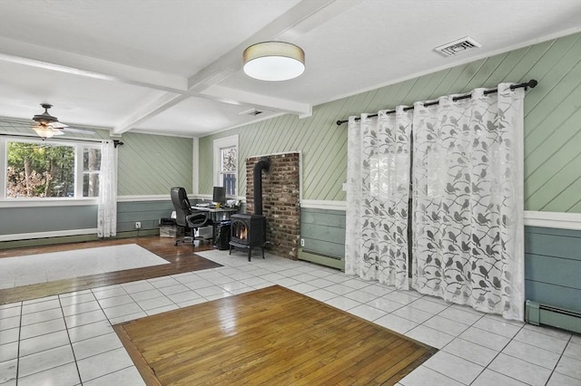 29 Shady Ave, Westminster, MA 01473 - unfurnished office with a wood stove, light tile patterned floors, visible vents, and beamed ceiling