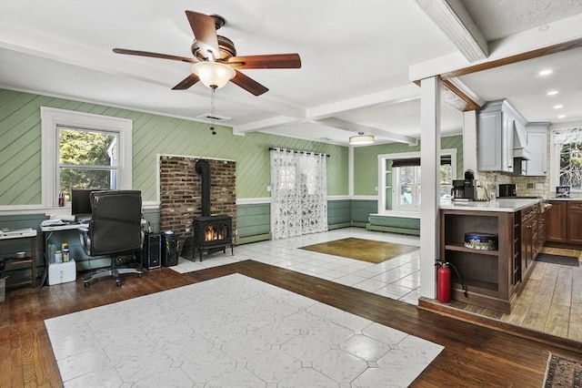 29 Shady Ave, Westminster, MA 01473 - home office featuring a wood stove, dark wood-style floors, a wealth of natural light, and beamed ceiling