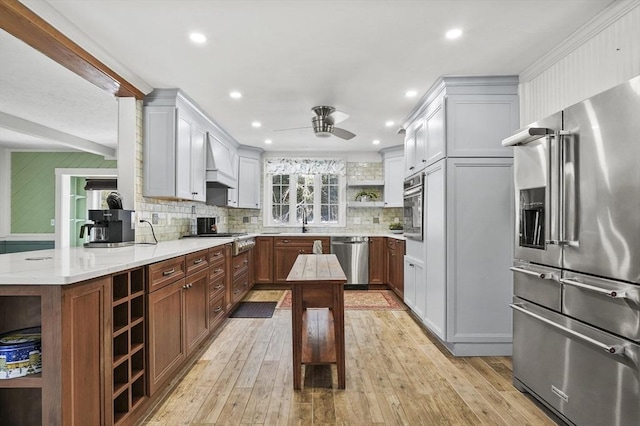 29 Shady Ave, Westminster, MA 01473 - kitchen with light wood finished floors, light stone countertops, custom exhaust hood, stainless steel appliances, and open shelves