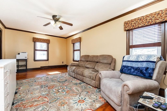 living room with hardwood / wood-style flooring, ornamental molding, and ceiling fan