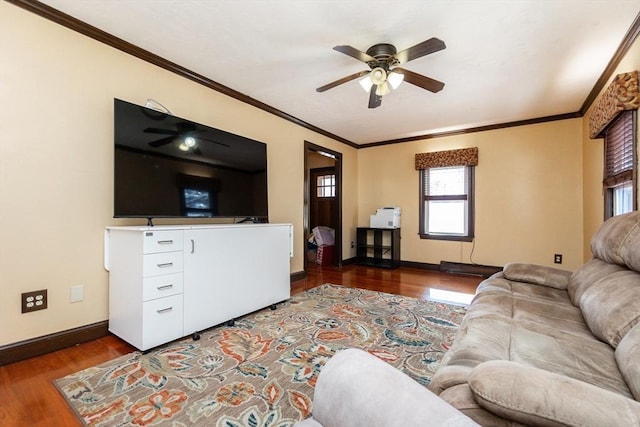 living room with wood-type flooring, ceiling fan, and ornamental molding