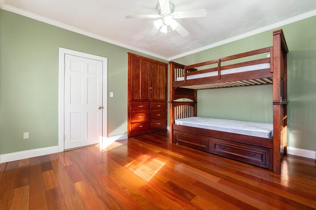 unfurnished bedroom with ceiling fan and ornamental molding