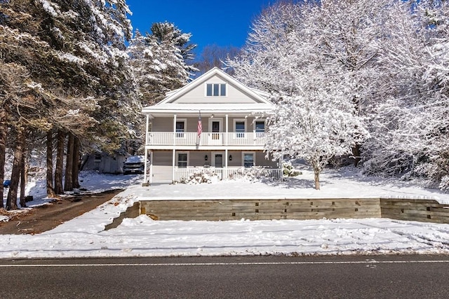 neoclassical / greek revival house featuring covered porch