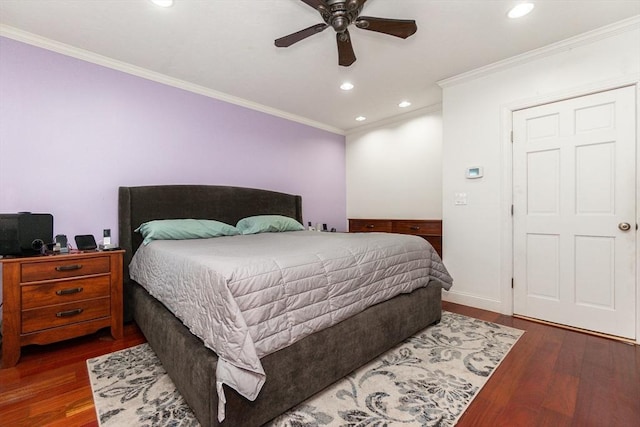 bedroom featuring ceiling fan, crown molding, and dark hardwood / wood-style flooring