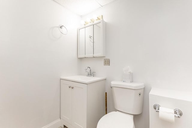 bathroom with toilet and vanity