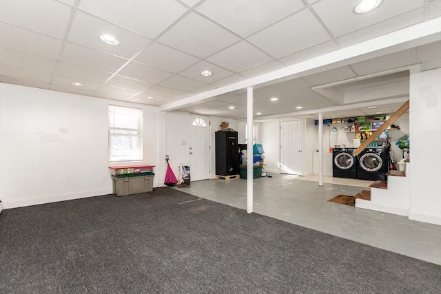 interior space with washing machine and dryer and a paneled ceiling