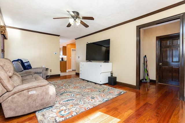 living room with ceiling fan, ornamental molding, and wood-type flooring