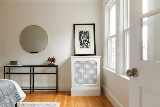 bedroom featuring light wood-type flooring and baseboards