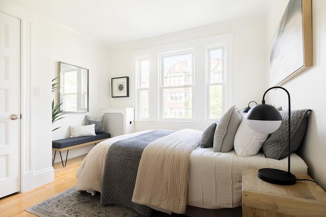 bedroom with wood finished floors