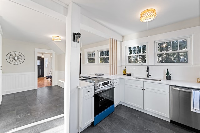 kitchen with sink, white cabinetry, and appliances with stainless steel finishes